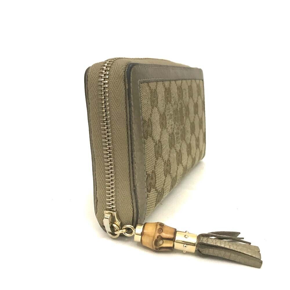 Gucci  Monogram Bamboo Tassel Zip Around Wallet Gold