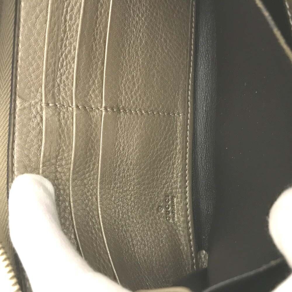 Gucci  Monogram Bamboo Tassel Zip Around Wallet Gold