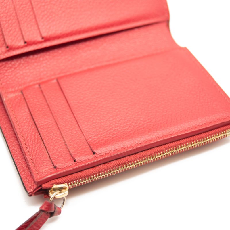 LOUIS VUITTON Empreinte Victorine Wallet in Red Pink