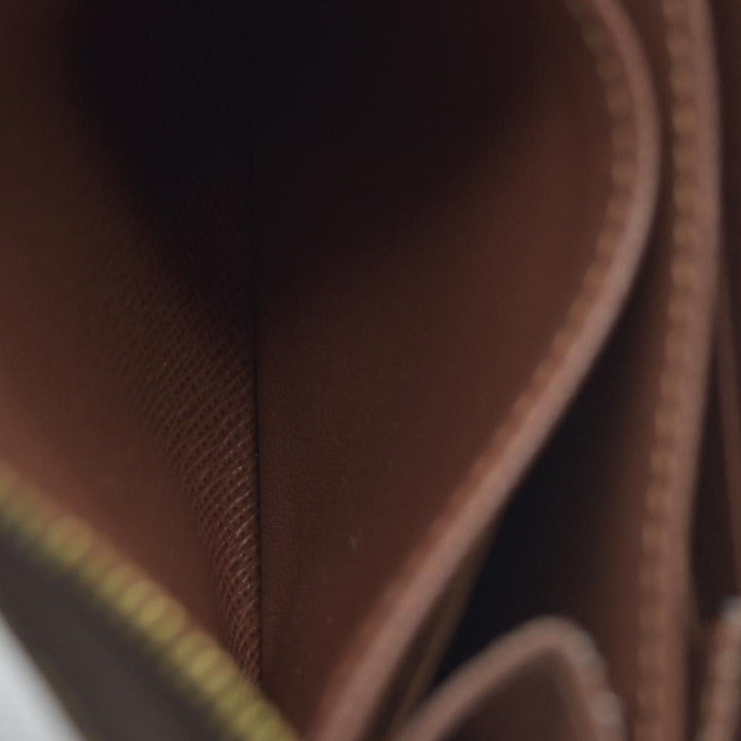 Louis Vuitton  Monogram Zippy Coin Purse $545