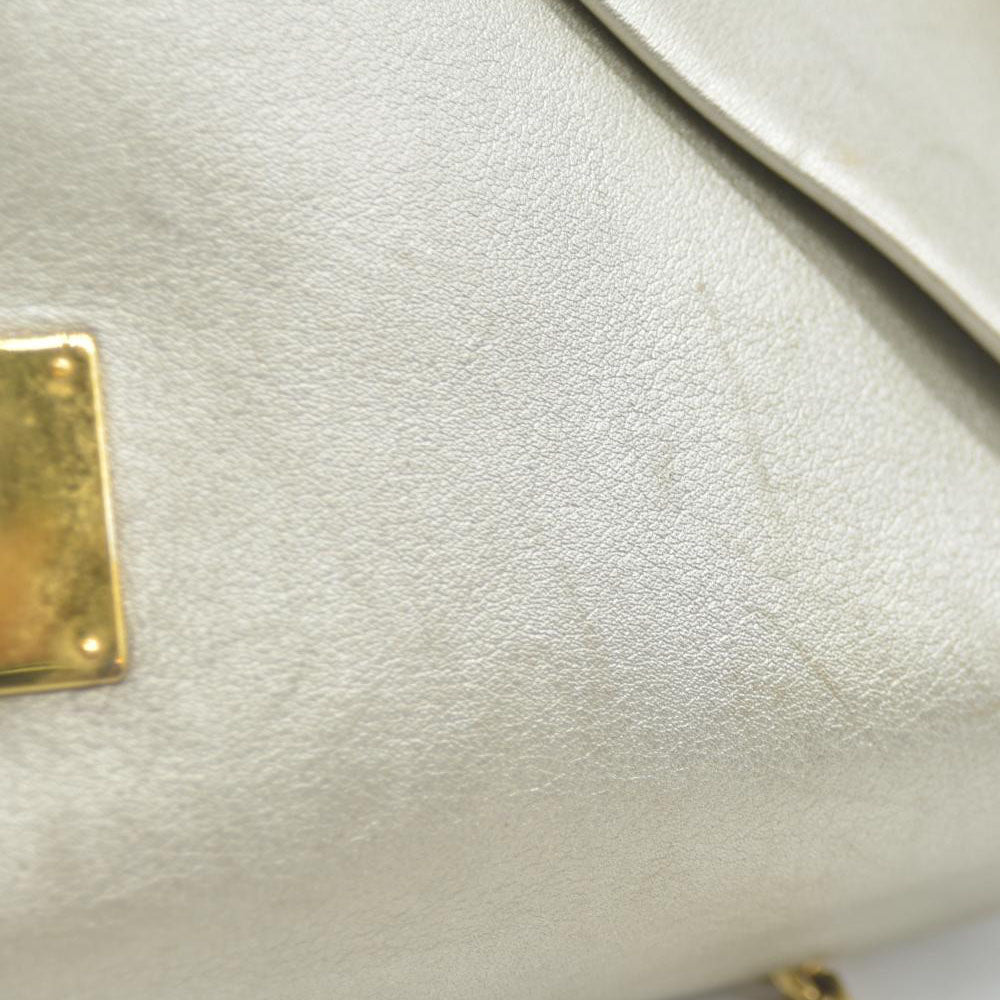 AUCTION $2150 Louis Vuitton  Metallic Calfskin Love Note Gold Bronze