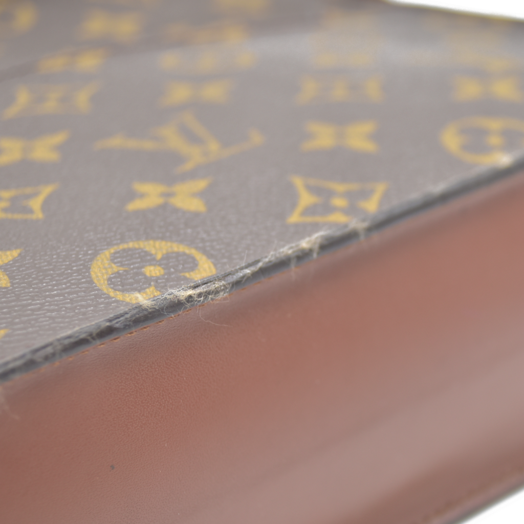 CONSIGNMENT AUCTION $1050 Louis Vuitton  Monogram Pochette Homme