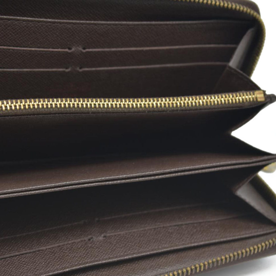 AUCTION $915 Louis Vuitton Damier Ebene Zippy Wallet