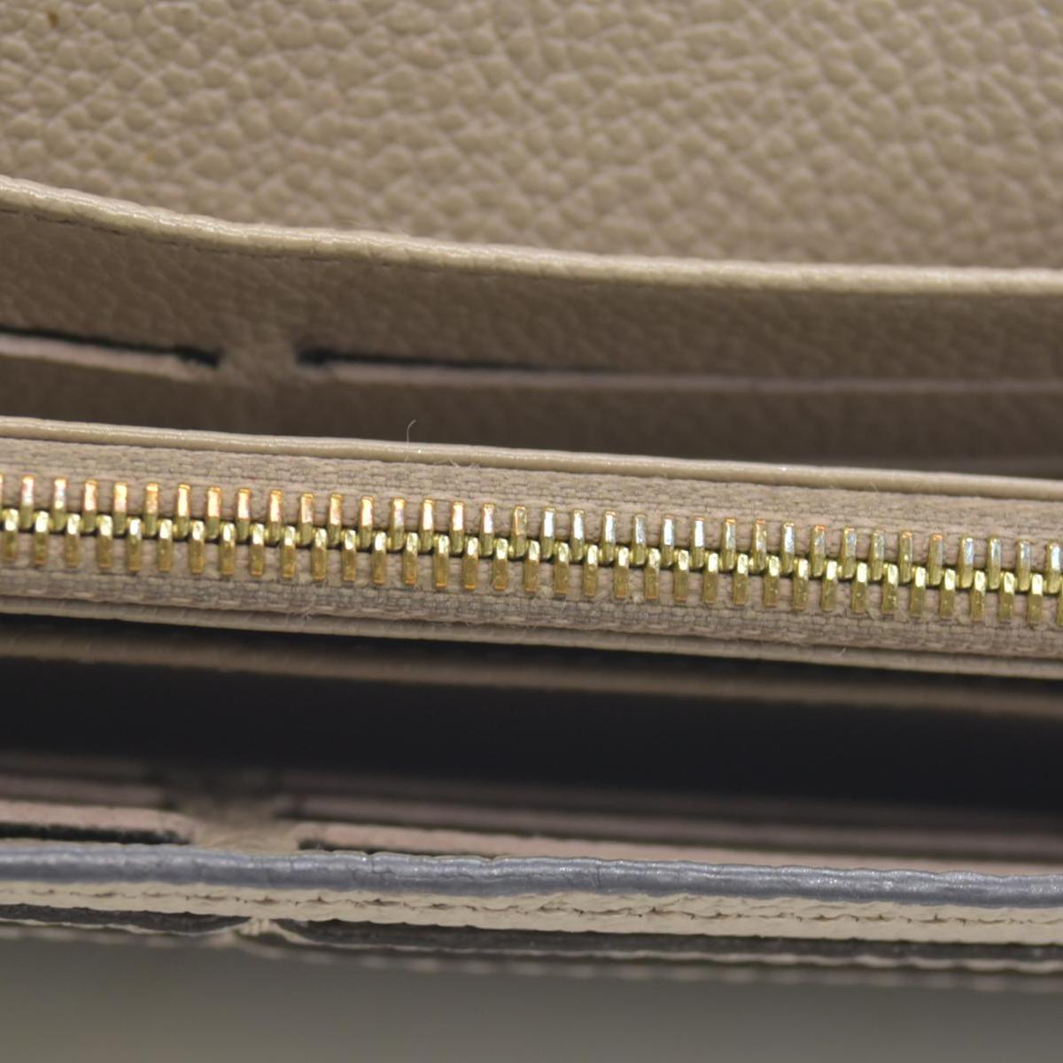 $1060 LOUIS VUITTON Portefeuille Sarah Monogram Empreinte Tourterelle Wallet