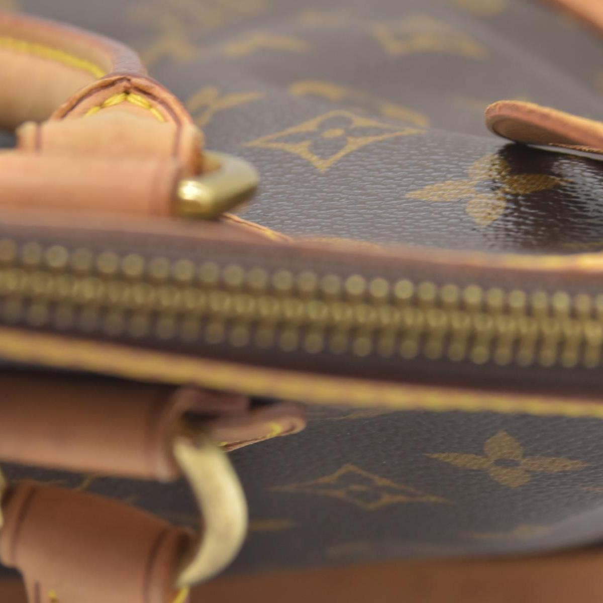 $1060 2006 Louis Vuitton Monogram Lockit PM FL0076
