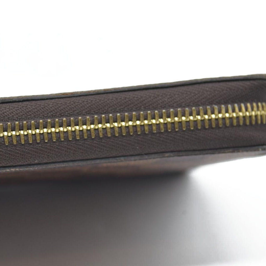 $915 2021 Louis Vuitton  Damier Ebene Zippy Wallet MI0231