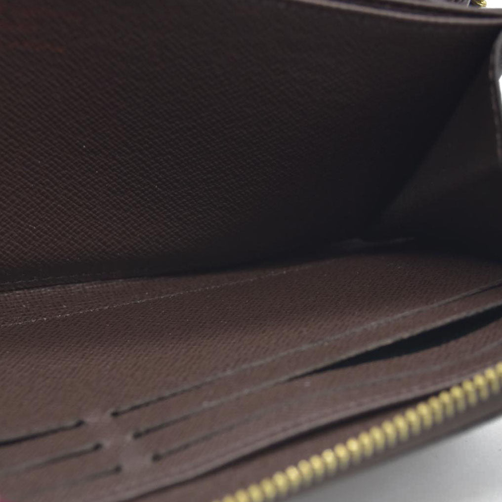 $915 2021 Louis Vuitton  Damier Ebene Zippy Wallet MI0231