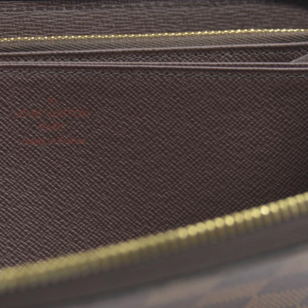 $915 2021 Louis Vuitton  Damier Ebene Zippy Wallet MI0231