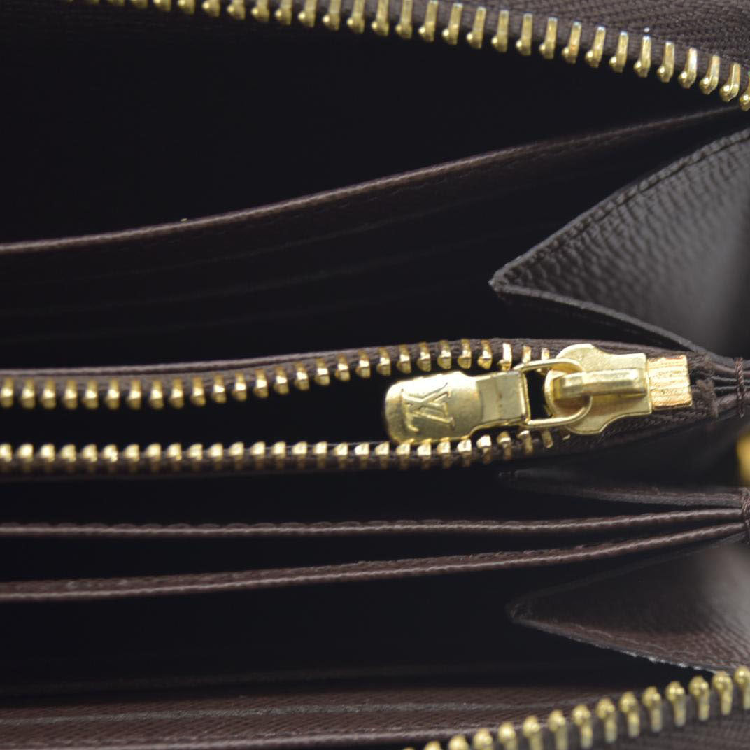 $915 2021 Louis Vuitton  Damier Ebene Zippy Wallet MI0231