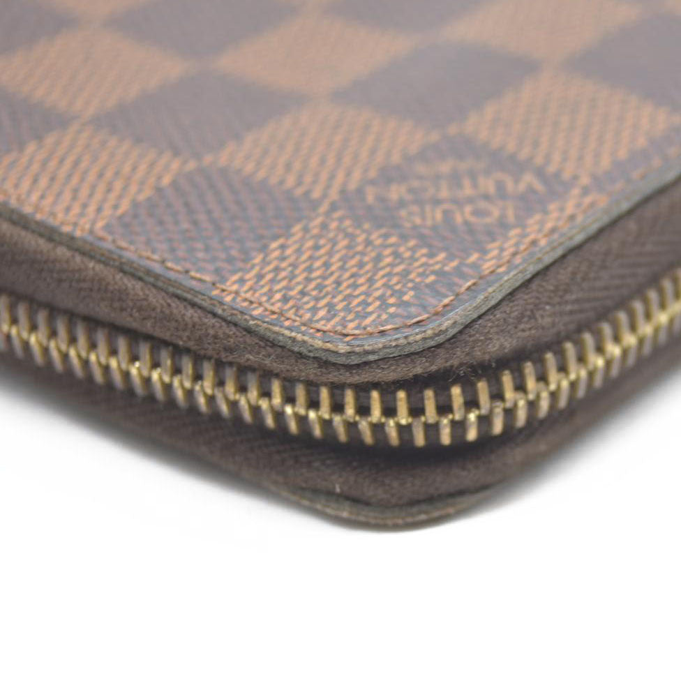 AUCTION $915 Louis Vuitton Damier Ebene Zippy Wallet CA2136