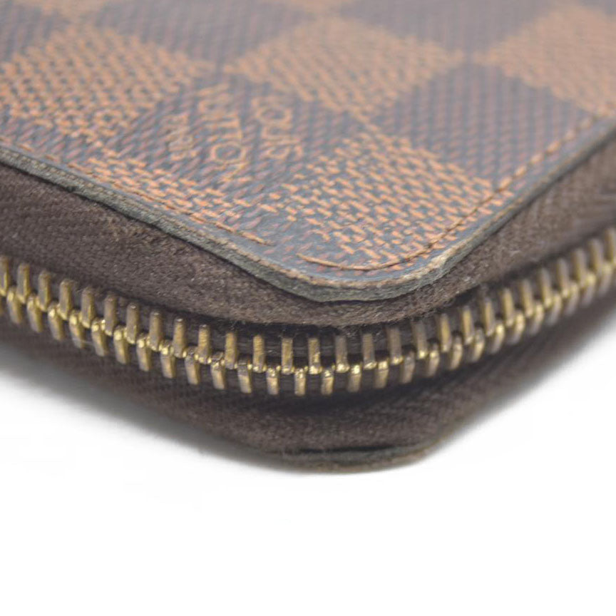 AUCTION $915 Louis Vuitton Damier Ebene Zippy Wallet CA2136
