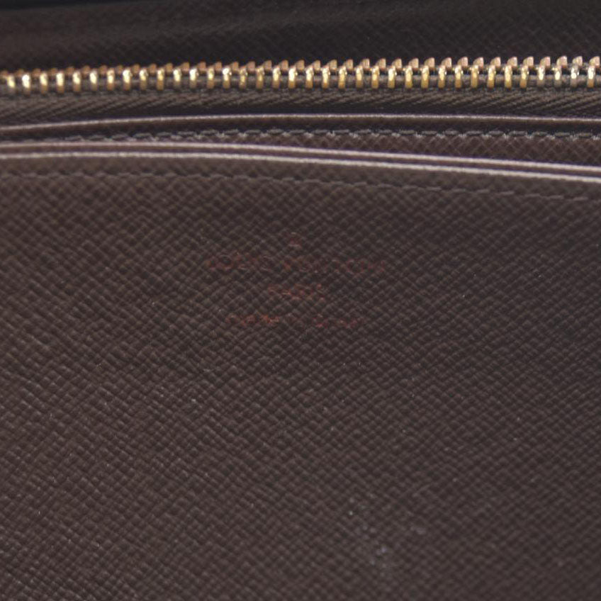 AUCTION $915 Louis Vuitton Damier Ebene Zippy Wallet CA2136