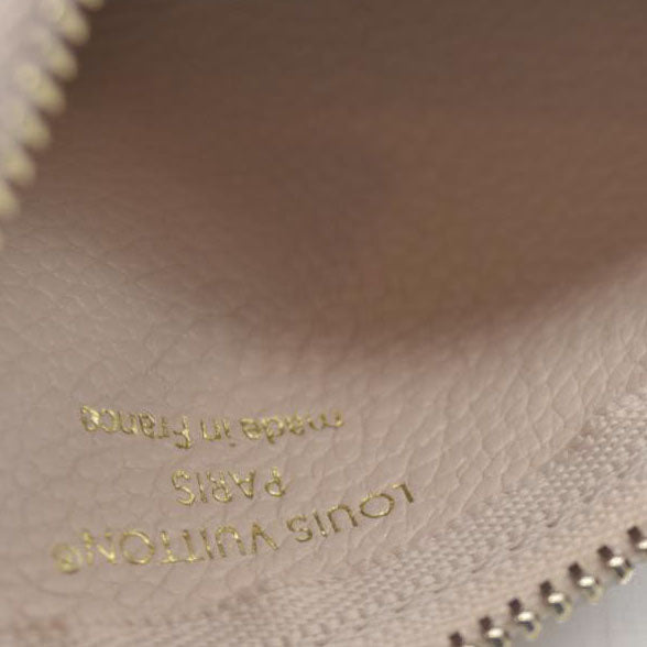 $625 Louis Vuitton  Empreinte Monogram Giant Key Pouch Dream Beige