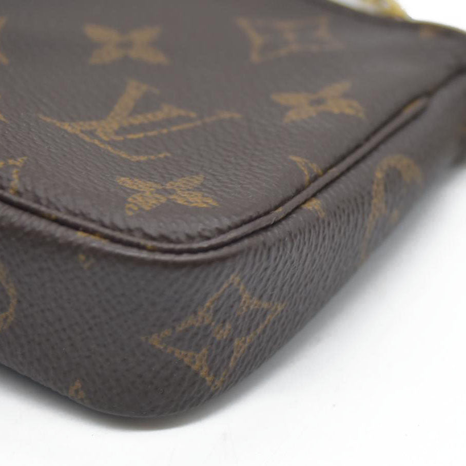 AUCTION  $1050 Louis Vuitton Monogram Mini Pochette Accessories SP2158