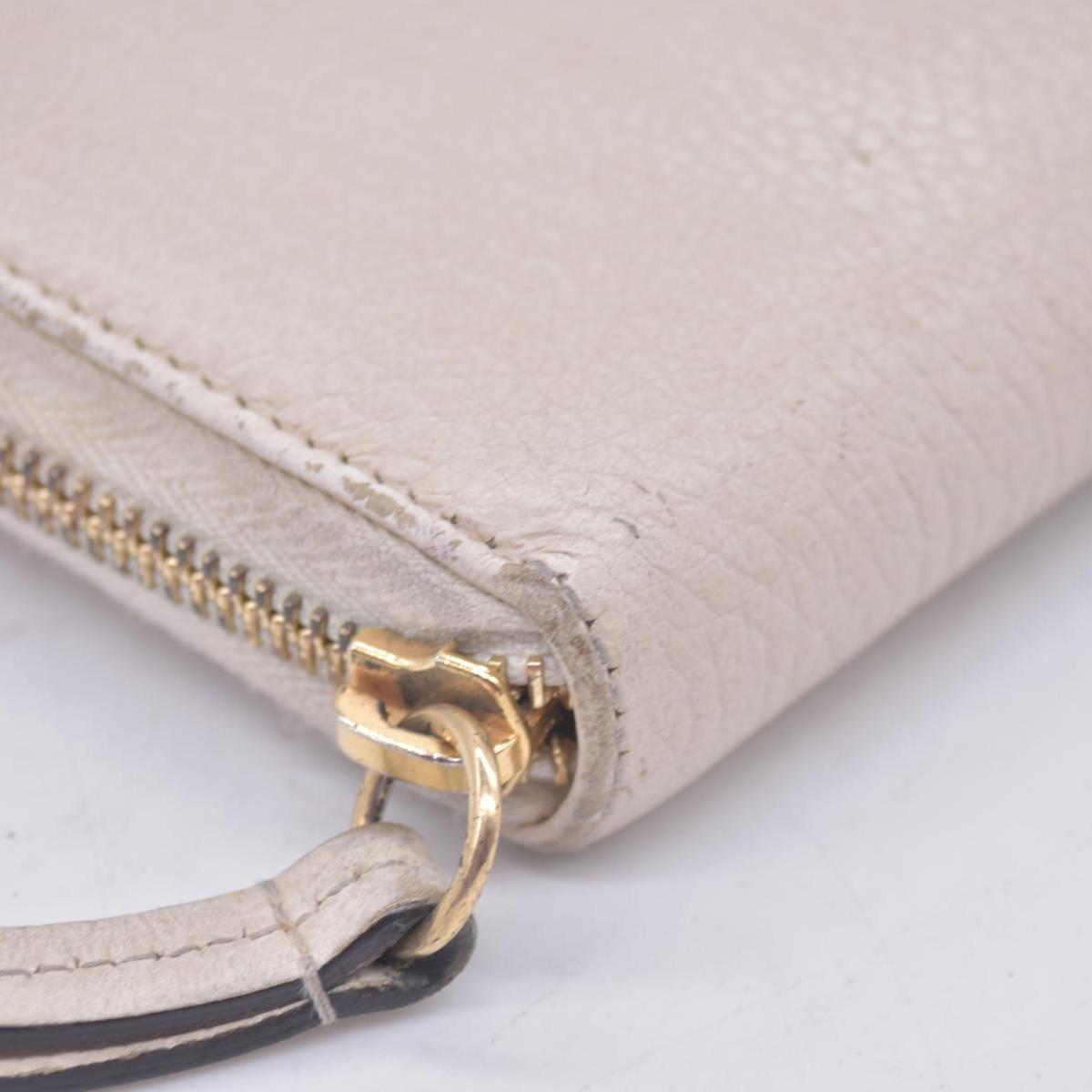 $660 2005 Gucci Cream GG Marmont zip around wallet 10021060