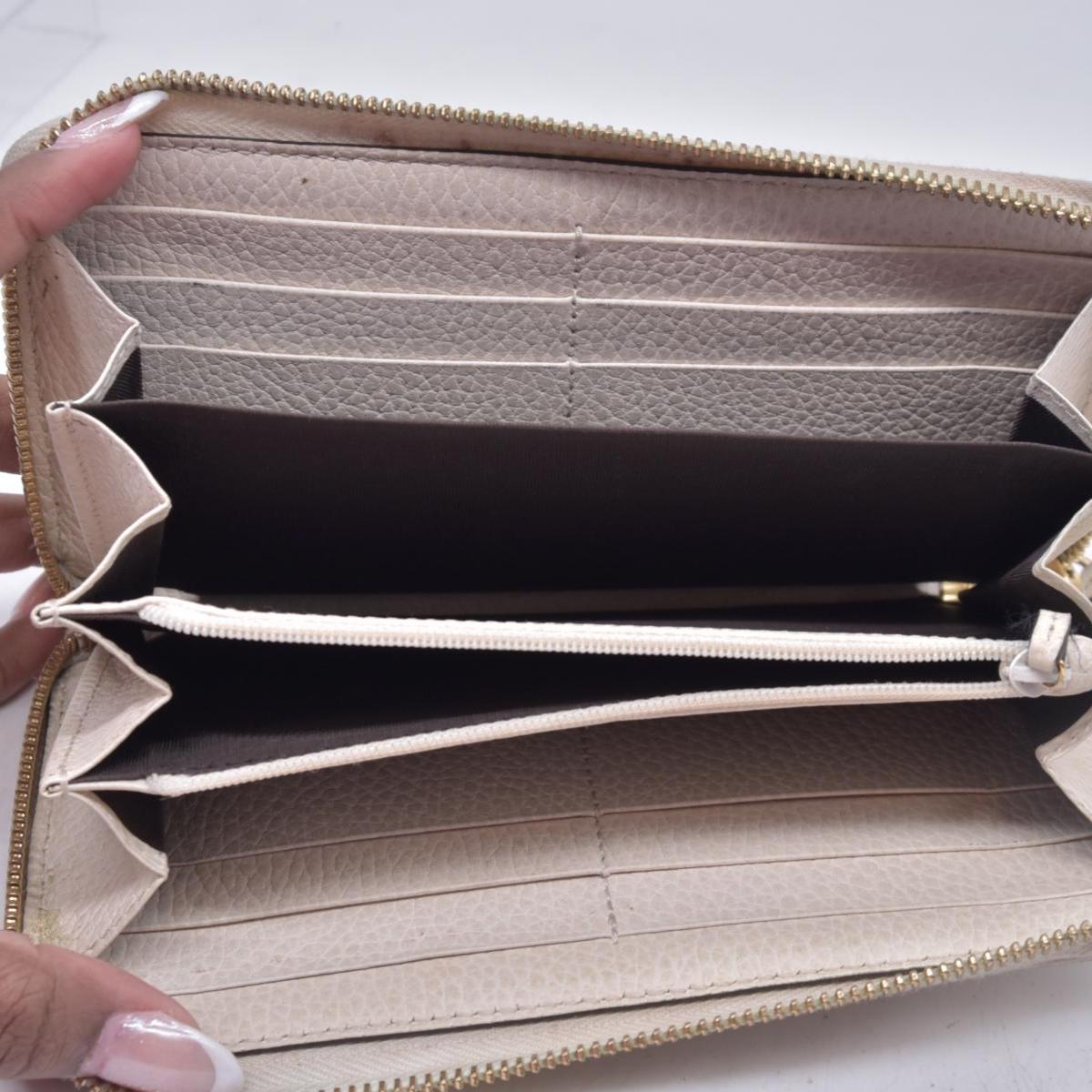 $660 2005 Gucci Cream GG Marmont zip around wallet 10021060