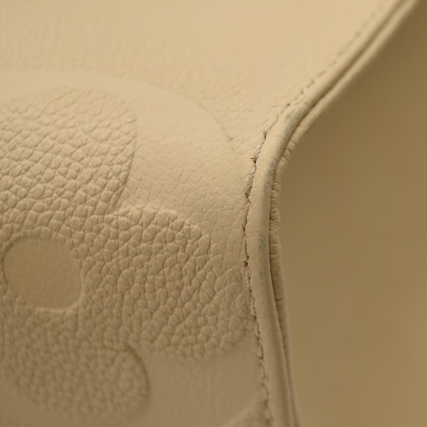 LOUIS VUITTON Empreinte Monogram Giant Onthego MM Creme