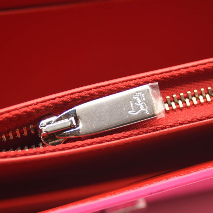 CHRISTIAN LOUBOUTIN LOUBI54 LEATHER WALLET ON A CHAIN FLUO PINK