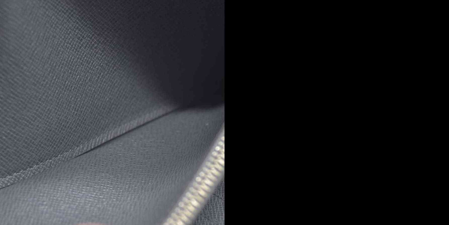 AUCTION $985 Louis Vuitton  Taiga Zippy Organizer Wallet Glacier