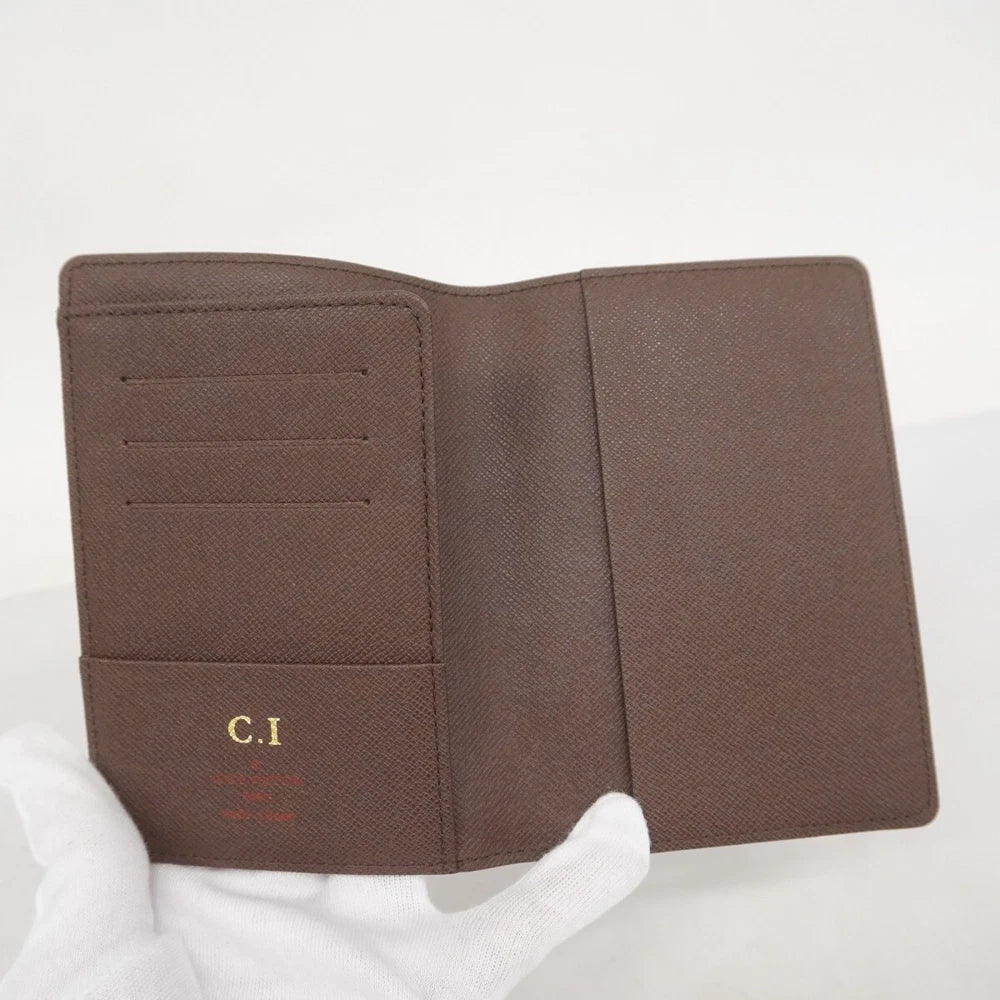 Louis Vuitton  $390 Damier Ebene Passport Cover CA2152