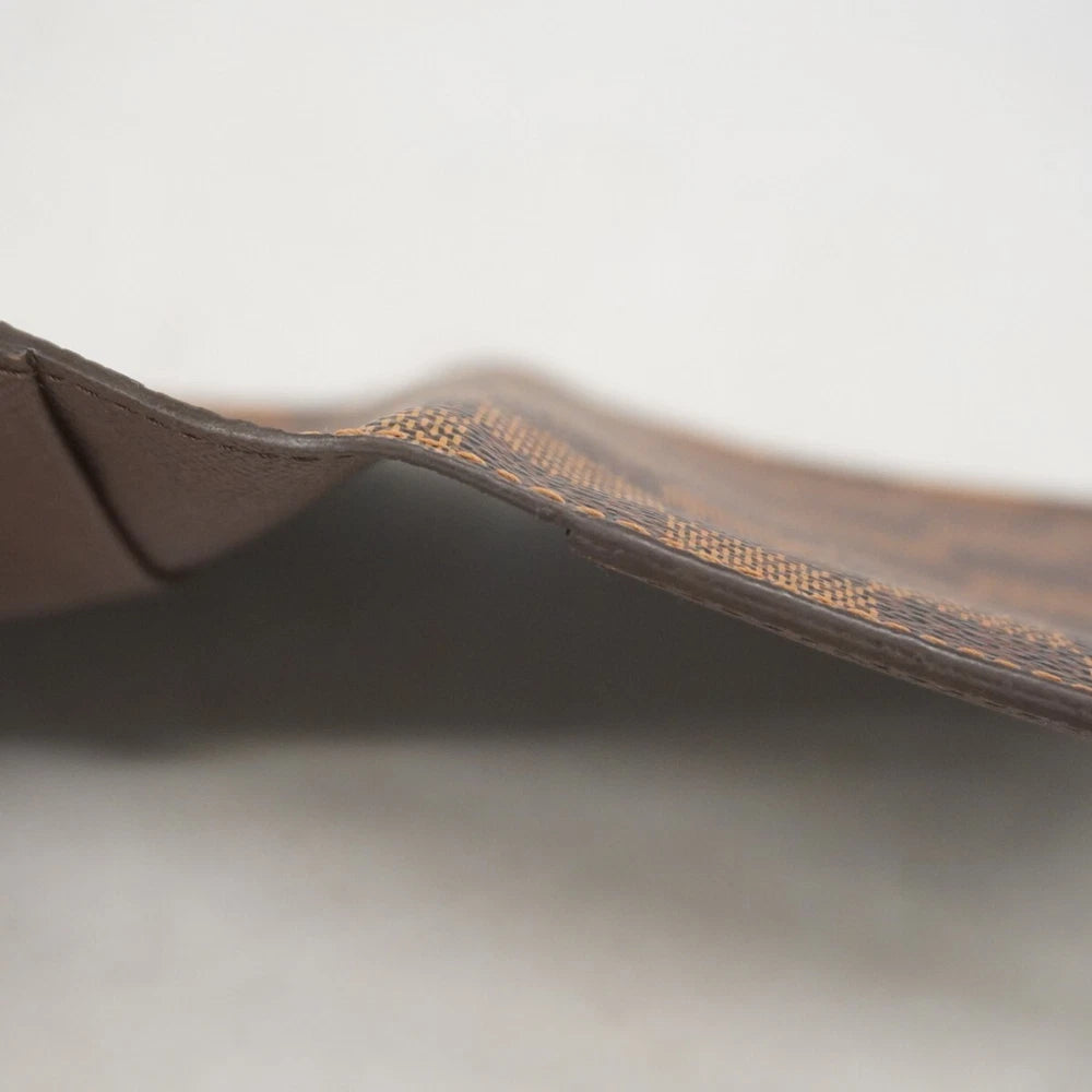 Louis Vuitton  $390 Damier Ebene Passport Cover CA2152